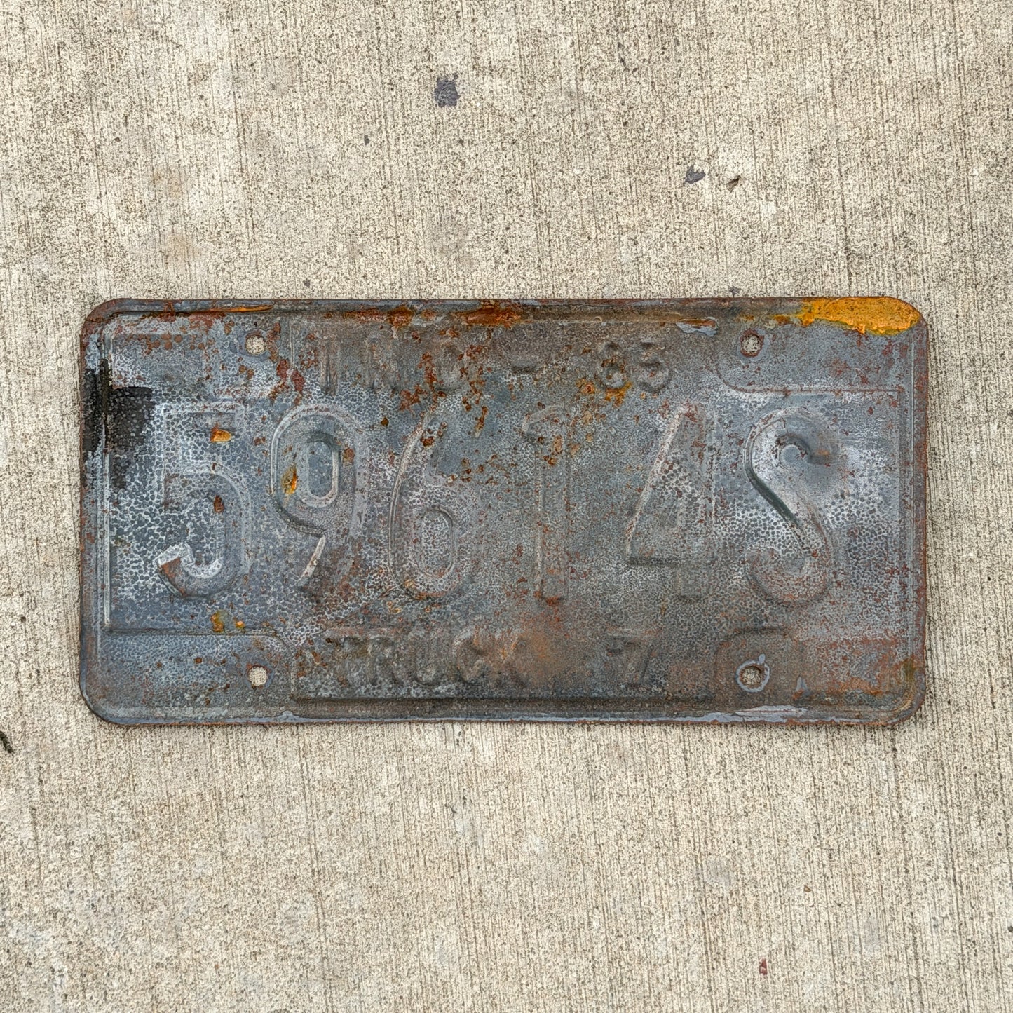 Photo of a 1983 Indiana Truck License Plate Auto Tag Garage Decor Vintage 59614 S with original patina