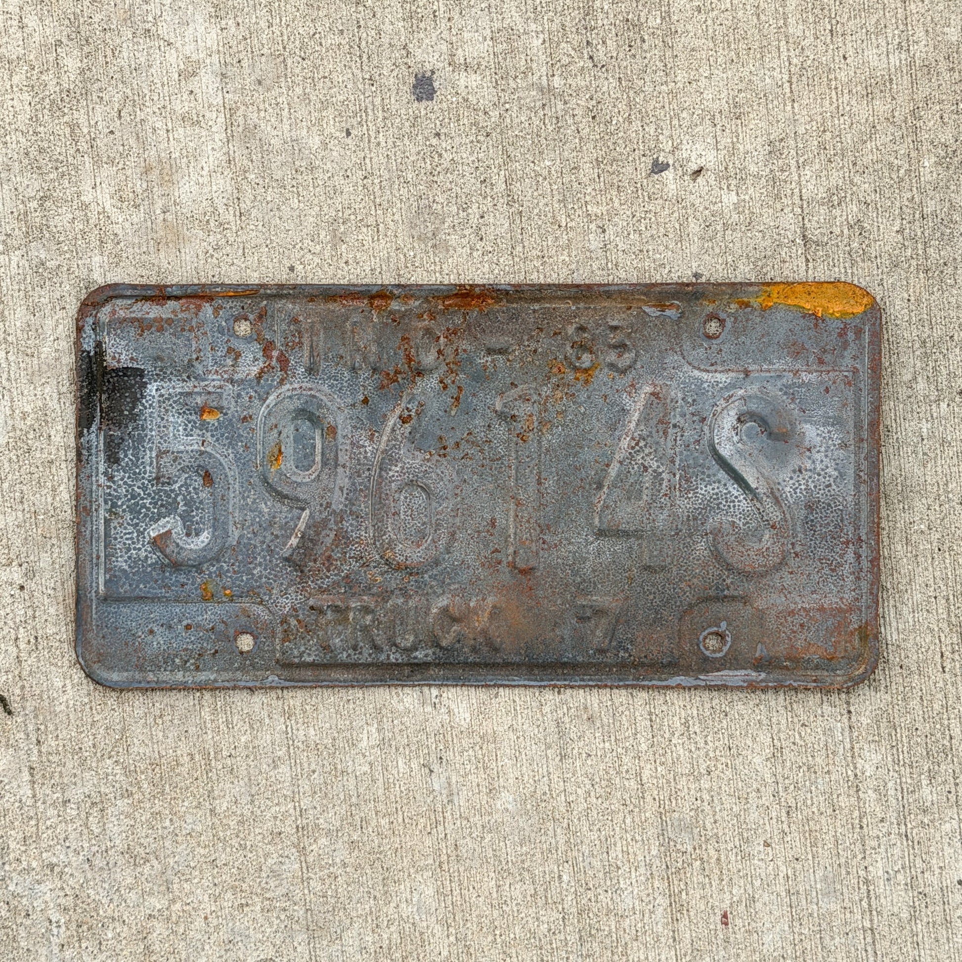 Photo of a 1983 Indiana Truck License Plate Auto Tag Garage Decor Vintage 59614 S with original patina