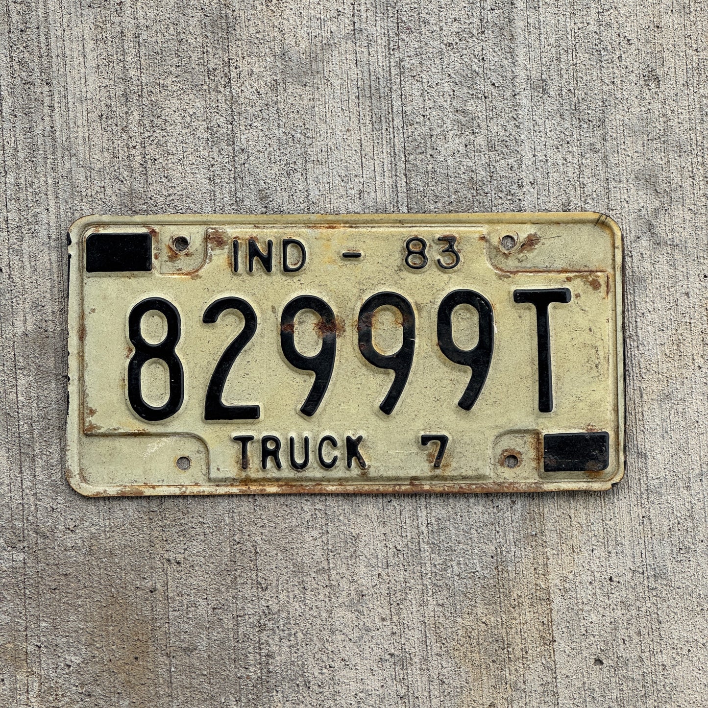Photo of a 1983 Indiana Truck License Plate Auto Tag Garage Decor Vintage Repeat Repeating 82999 T with original patina
