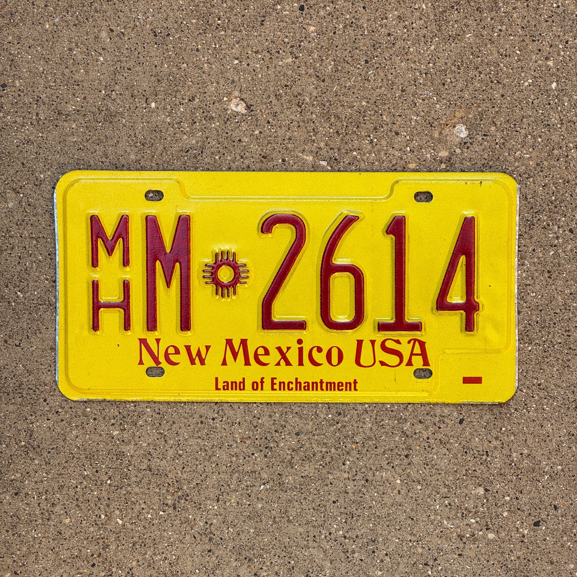 Photo of a 1983 New Mexico Mobile Home License Plate Auto Tag Garage Decor Vintage Zia MH M 2614