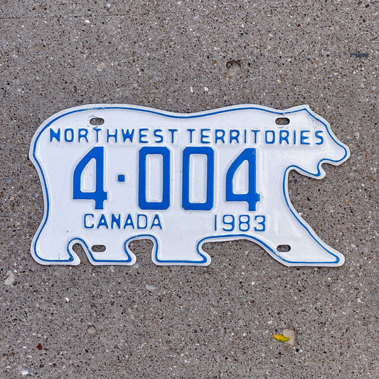 Photo of a 1983 Northwest Territories License Plate Auto Tag Garage Decor Vintage Low Number Four Digit Bear 4 004