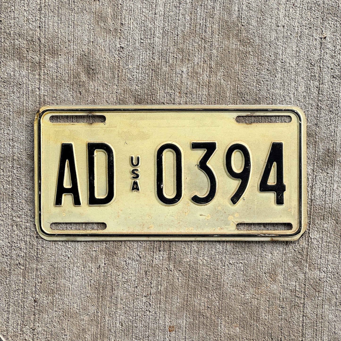 Photo of a 1983 US Forces Germany License Plate Auto Tag 2 Vintage Garage AD 0394 with original patina