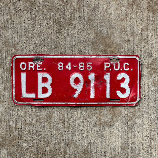 Photo of a 1984 1985 Oregon Public Utility Commission License Plate Auto Tag Garage Decor Vintage LB 9113 with original patina