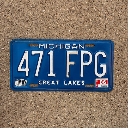 Photo of a 1984 1986 Michigan License Plate Auto Tag Garage Decor Vintage 471 FPG