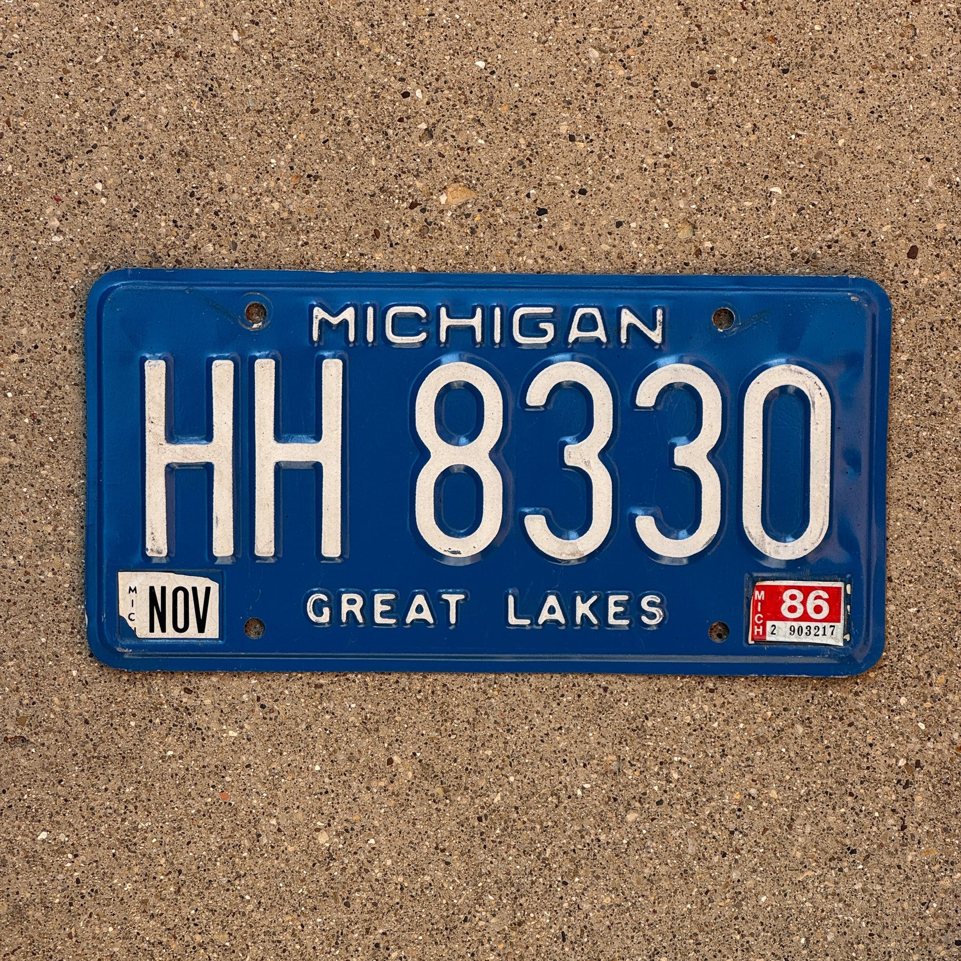 Photo of a 1984 1986 Michigan License Plate Auto Tag Garage Decor Vintage HH 8330