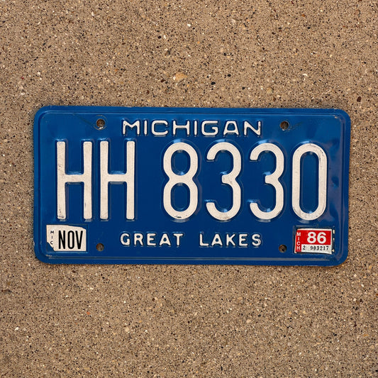 Photo of a 1984 1986 Michigan License Plate Auto Tag Garage Decor Vintage HH 8330