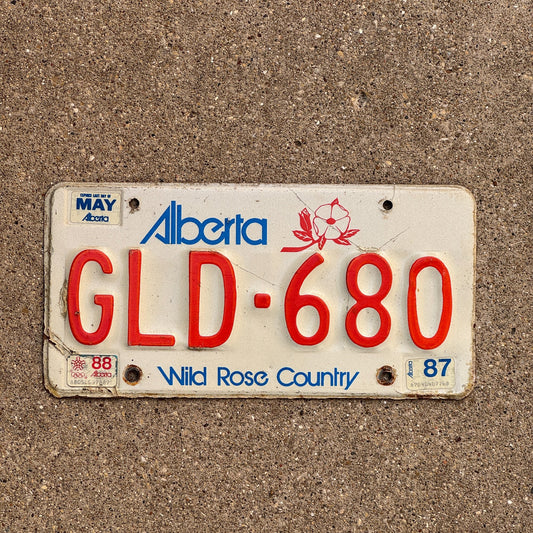 Photo of a 1984 1987 Alberta License Plate Auto Tag Garage Decor Vintage GLD 680