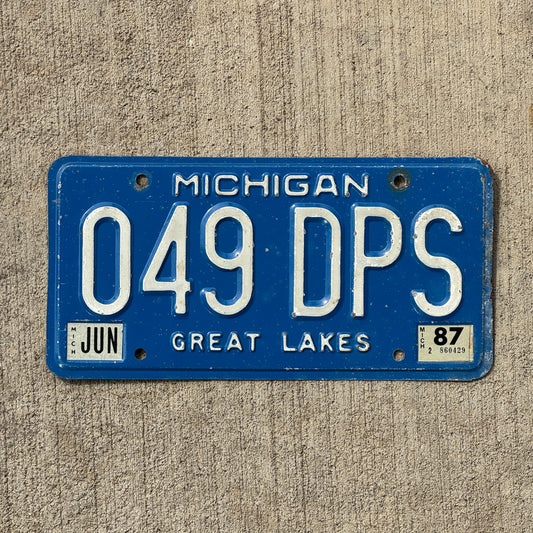 Photo of a 1984 1987 Michigan License Plate Auto Tag Garage Decor Vintage 049 DPS with original patina