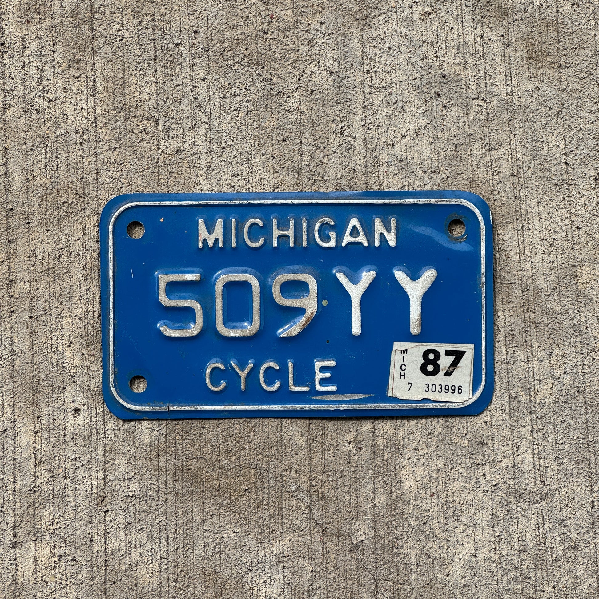 Photo of a 1984 1987 Michigan Motorcycle License Plate Auto Tag Garage Decor Vintage 509 YY with original patina