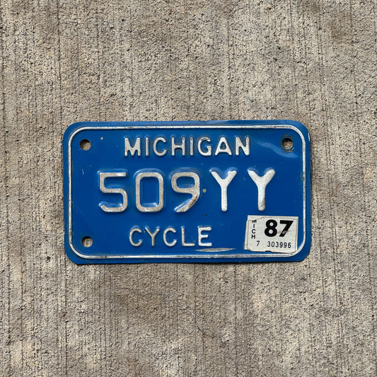 Photo of a 1984 1987 Michigan Motorcycle License Plate Auto Tag Garage Decor Vintage 509 YY with original patina
