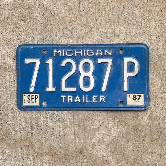 Photo of a 1984 1987 Michigan Trailer License Plate Auto Tag Garage Decor Vintage 71287 P with original patina