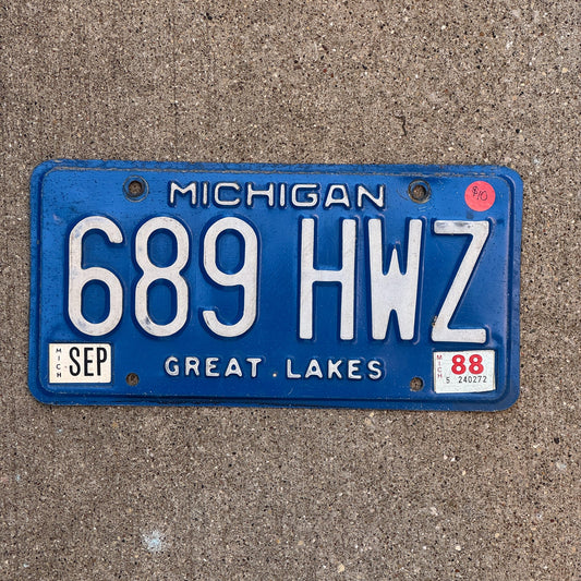 Photo of a 1984 1988 Michigan License Plate Auto Tag Garage Decor Vintage 689 HWZ with original patina