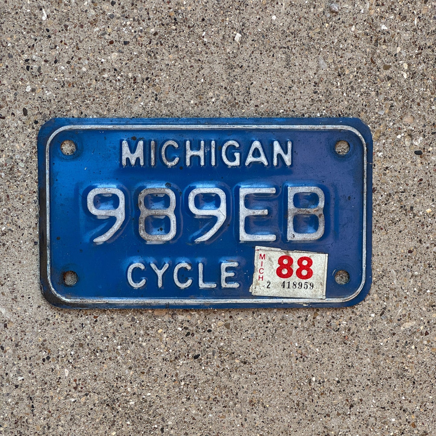 Photo of a 1984 1988 Michigan Motorcycle License Plate Auto Tag Garage Decor Vintage 989 EB