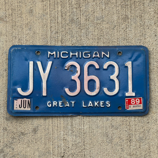 Photo of a 1984 1989 Michigan Commercial License Plate Auto Tag Garage Decor Vintage JY 3631 with original patina