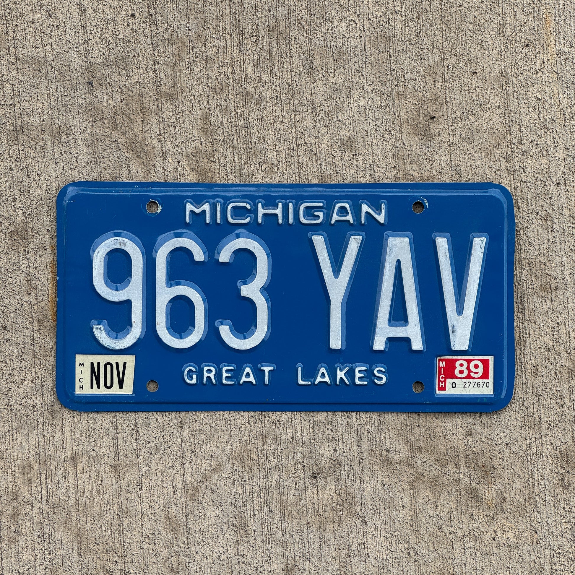 Photo of a 1984 1989 Michigan License Plate Auto Tag Garage Decor Vintage 963 YAV with original patina