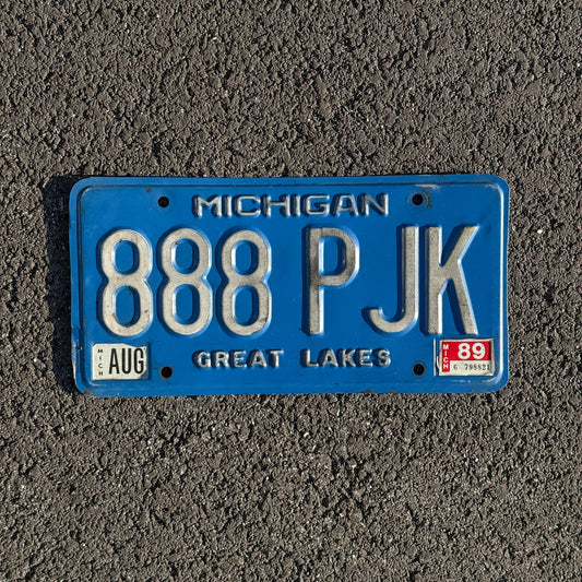 Photo of a 1984 1989 Michigan License Plate Auto Tag Garage Decor Vintage Blue, Repeat Repeating 888 PJK