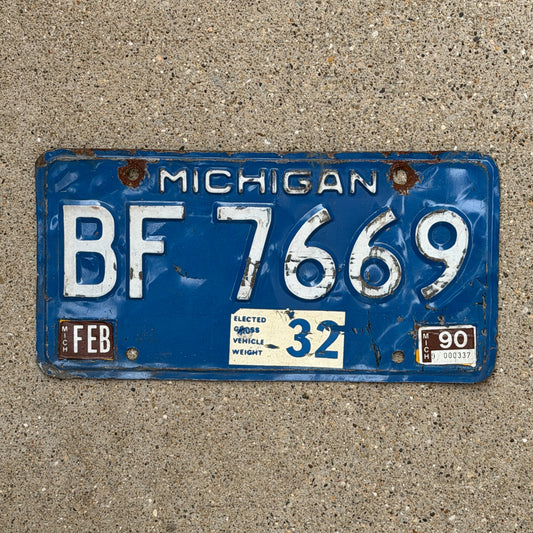 Photo of a 1984 1990 Michigan Commercial License Plate Auto Tag Garage Decor Vintage Heavy Commercial BF 7669 with original patina
