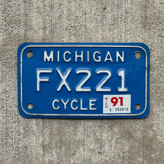 Photo of a 1984 1991 Michigan Motorcycle License Plate Auto Tag Garage Decor Vintage FX 221 with original patina
