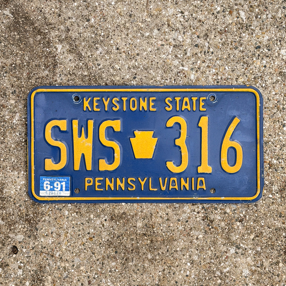 Photo of a 1984 1991 Pennsylvania License Plate Auto Tag Garage Decor Vintage SWS 316 with original patina