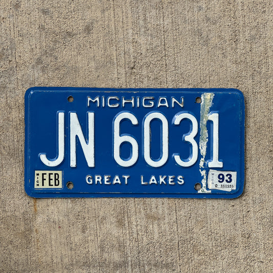 Photo of a 1984 1993 Michigan Commercial License Plate Auto Tag Garage Decor Vintage JN 6031 with original patina