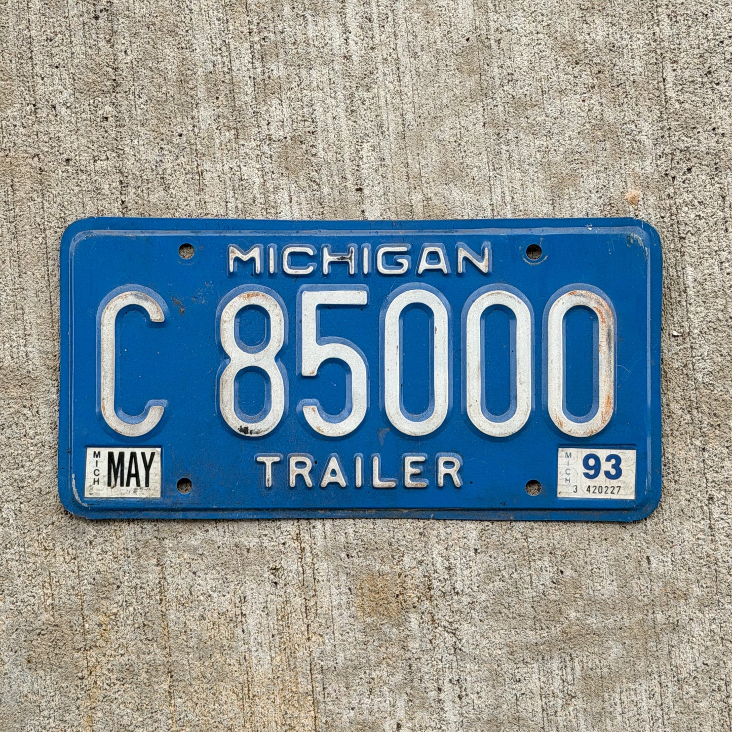Photo of a 1984 1993 Michigan Trailer License Plate Auto Tag Garage Decor Vintage Repeat Repeating C 85000 with original patina
