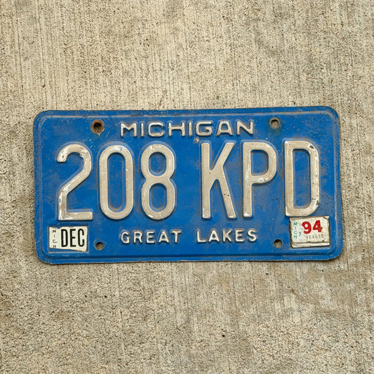 Photo of a 1984 1994 Michigan License Plate Auto Tag Garage Decor Vintage 208 KPD with original patina