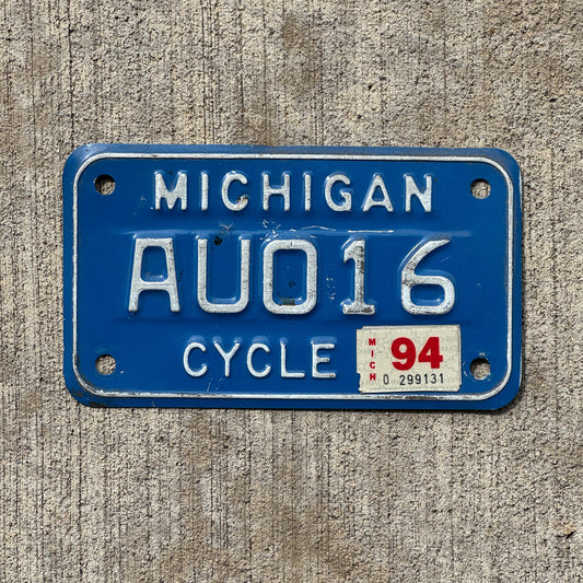 Photo of a 1984 1994 Michigan Motorcycle License Plate Auto Tag Garage Decor Vintage AUO 16 with original patina