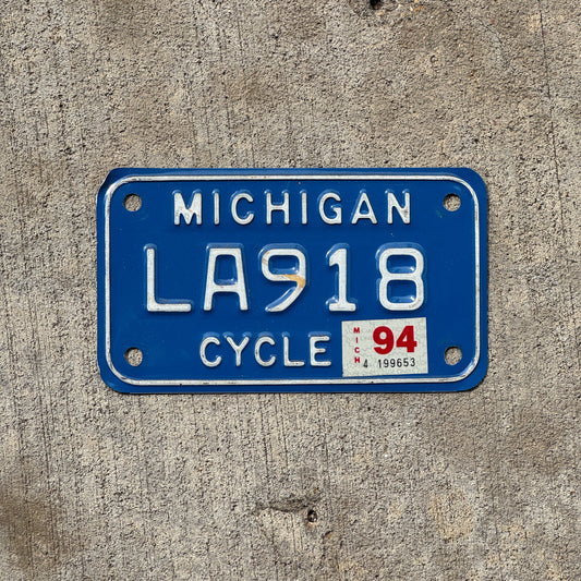 Photo of a 1984 1994 Michigan Motorcycle License Plate Auto Tag Garage Decor Vintage LA 918 with original patina