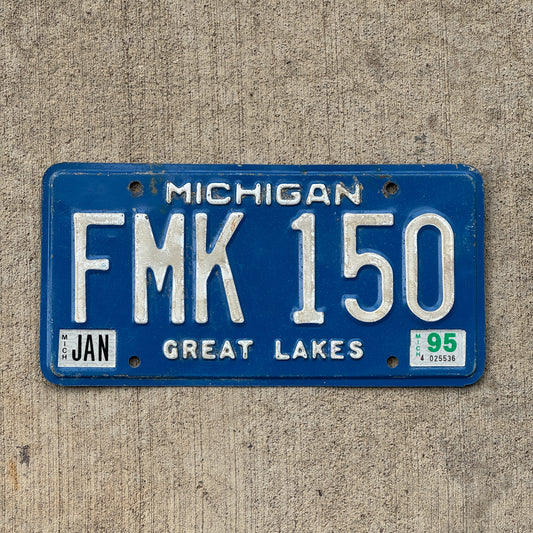 Photo of a 1984 1995 Michigan License Plate Auto Tag Garage Decor Vintage FMK 150 with original patina