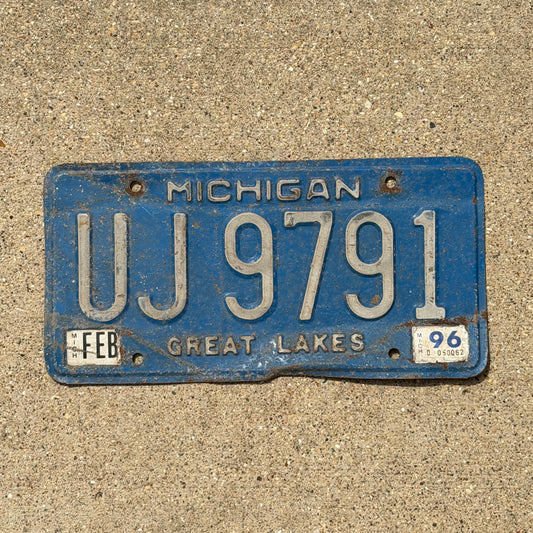 Photo of a 1984 1996 Michigan Commercial License Plate Auto Tag Garage Decor Vintage UJ 9791 with original patina