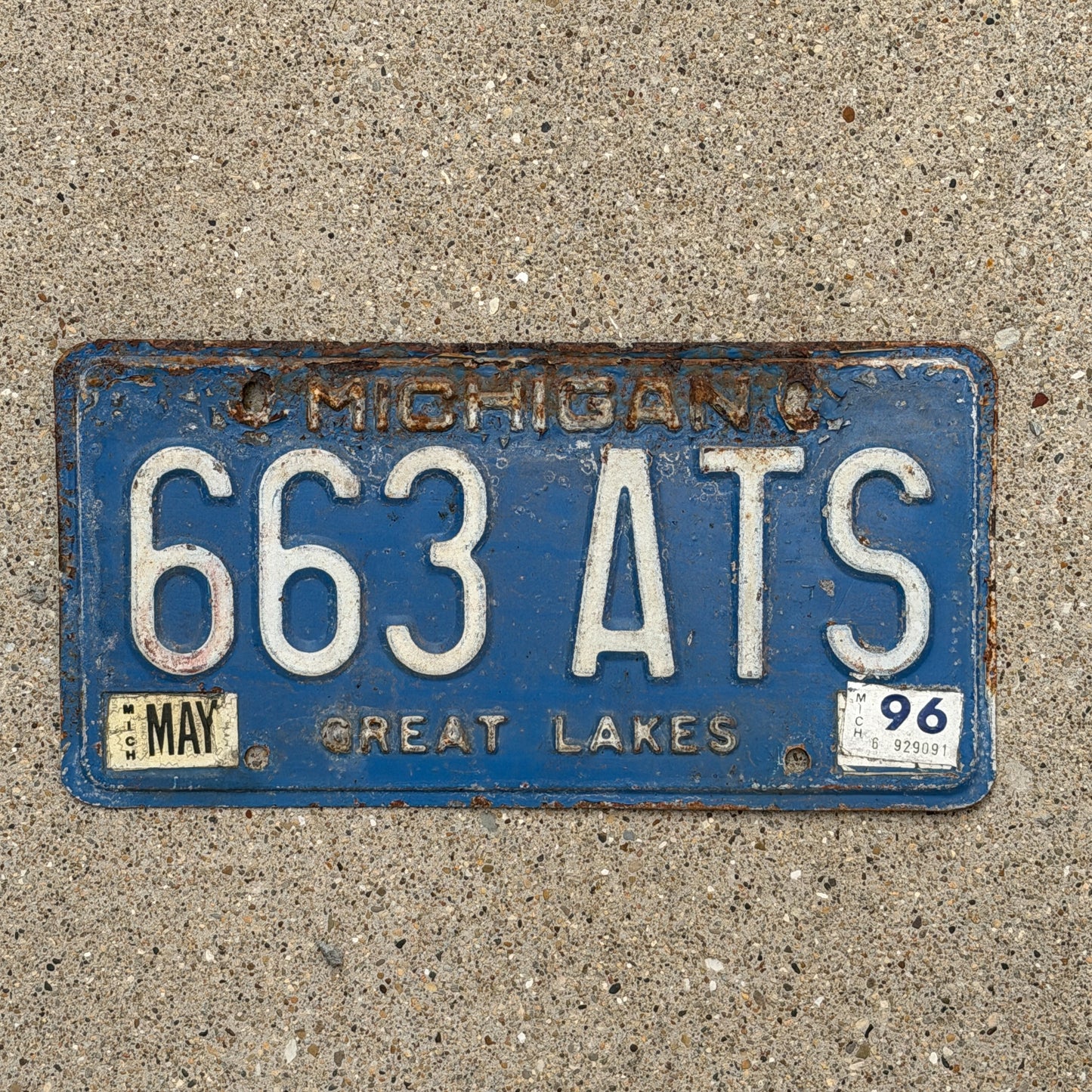 Photo of a 1984 1996 Michigan License Plate Auto Tag Garage Decor Vintage 663 ATS with original patina