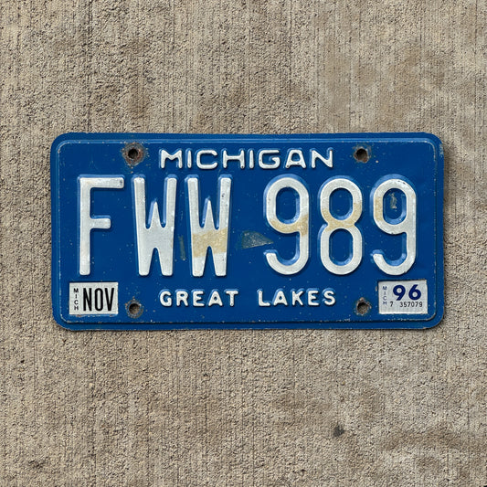 Photo of a 1984 1996 Michigan License Plate Auto Tag Garage Decor Vintage FWW 989 with original patina