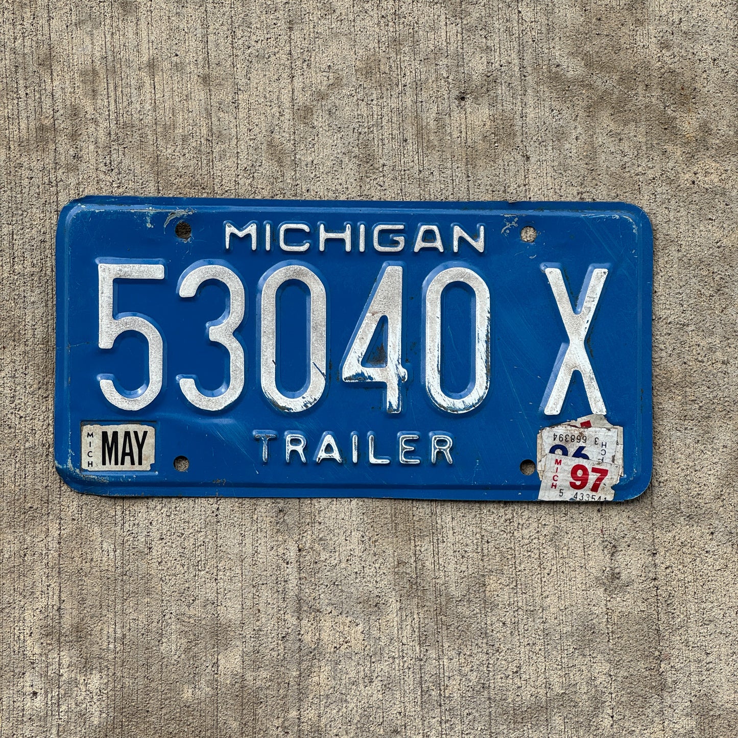 Photo of a 1984 1997 Michigan Trailer License Plate Auto Tag Garage Decor Vintage 53040 X with original patina