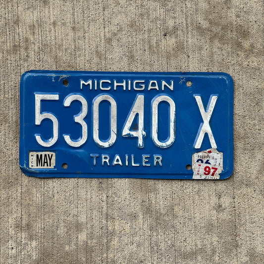 Photo of a 1984 1997 Michigan Trailer License Plate Auto Tag Garage Decor Vintage 53040 X with original patina