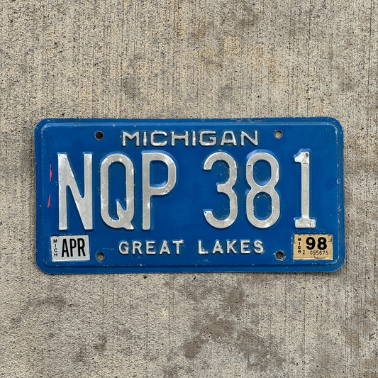 Photo of a 1984 1998 Michigan License Plate Auto Tag Garage Decor Vintage NQP 381 with original patina