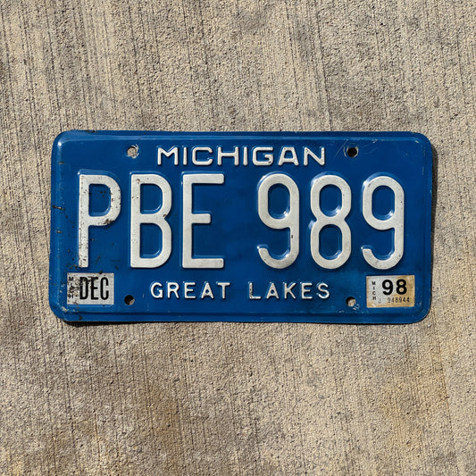 Photo of a 1984 1998 Michigan License Plate Auto Tag Garage Decor Vintage PBE 989 with original patina
