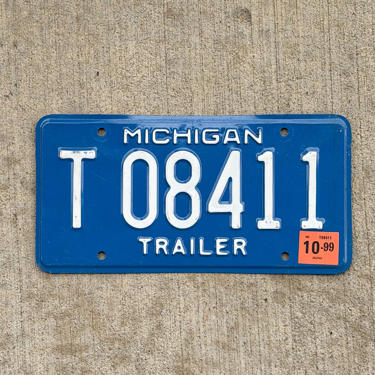 Photo of a 1984 1999 Michigan Trailer License Plate Auto Tag Garage Decor Vintage T 08411 with original patina