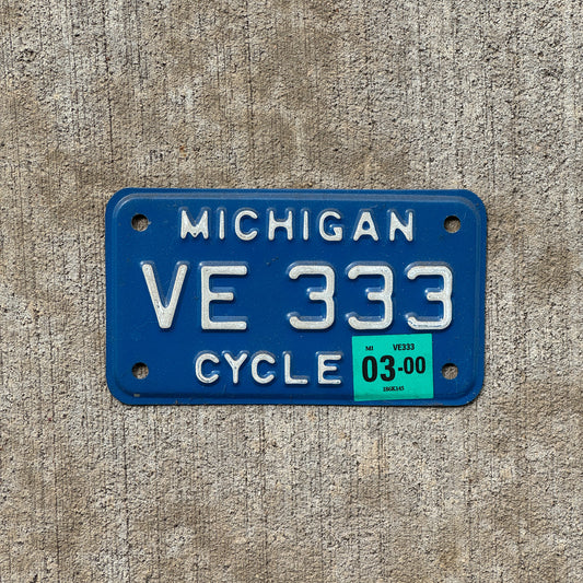 Photo of a 1984 2000 Michigan Motorcycle License Plate Auto Tag Garage Decor Vintage Repeat Repeating VE 333 with original patina