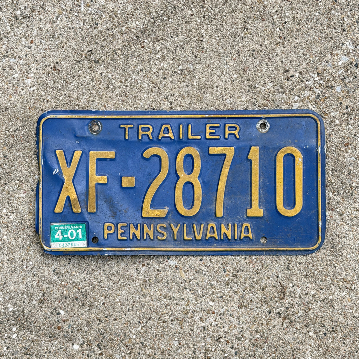 Photo of a 1984 2001 Pennsylvania Trailer License Plate Auto Tag Garage Decor Vintage XF 28710 with original patina