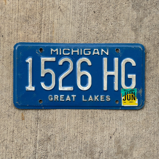 Photo of a 1984 2002 Michigan Commercial License Plate Auto Tag Garage Decor Vintage 1526 HG with original patina