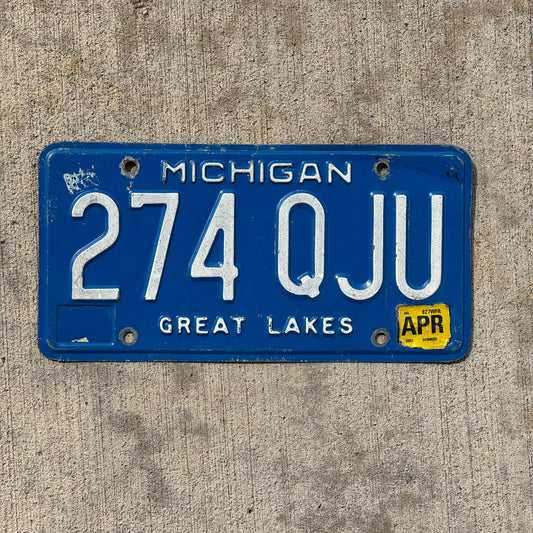 Photo of a 1984 2002 Michigan License Plate Auto Tag Garage Decor Vintage 274 QJU with original patina