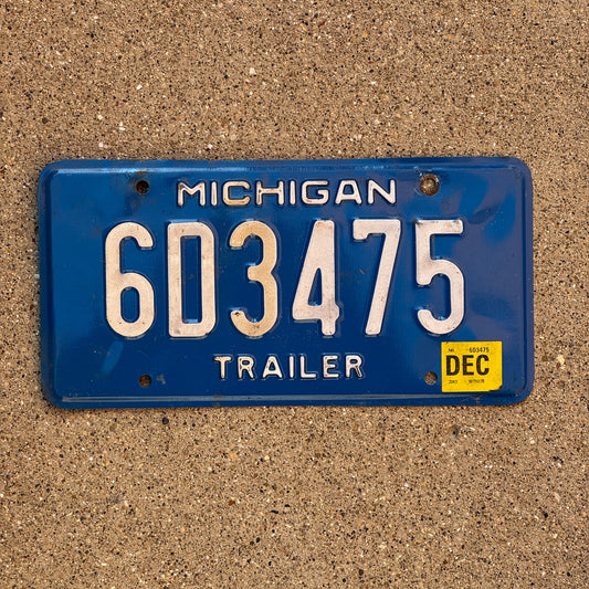 Photo of a 1984 2002 Michigan Trailer License Plate Auto Tag Garage Decor Vintage 6D3475