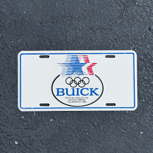 Photo of a 1984 Buick Official Cars of Los Angeles Olympics California Booster License Plate Auto Tag 1 Vintage Garage
 Metal with original patina