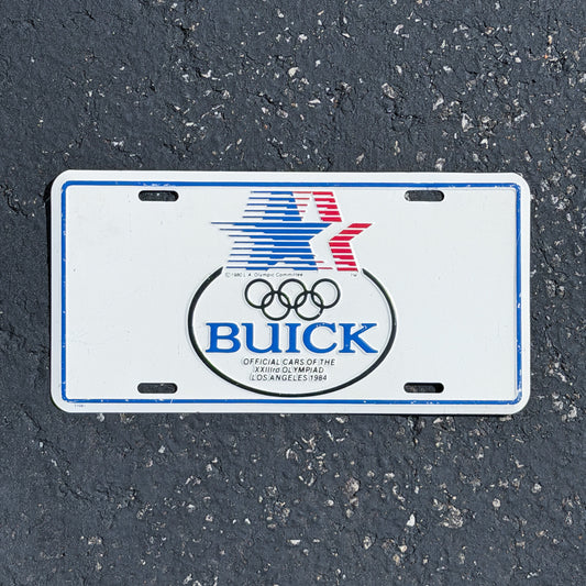 Photo of a 1984 Buick Official Cars of Los Angeles Olympics California Booster License Plate Auto Tag 1 Vintage Garage
 Metal with original patina