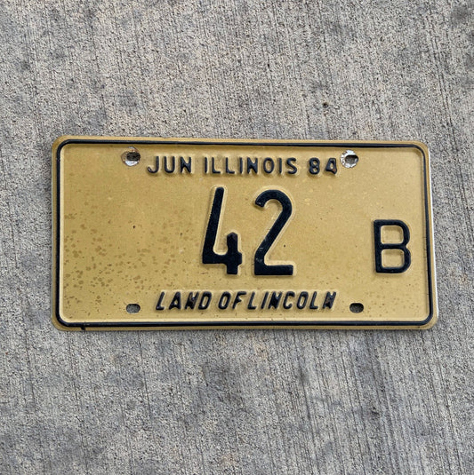 Photo of a 1984 Illinois Truck License Plate Auto Tag Garage Decor Vintage Low Number Two Digit 42 B with original patina