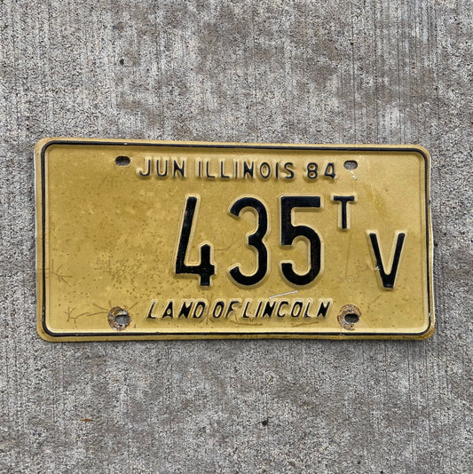 Photo of a 1984 Illinois Truck Tractor License Plate Auto Tag Garage Decor Vintage 435 TV with original patina
