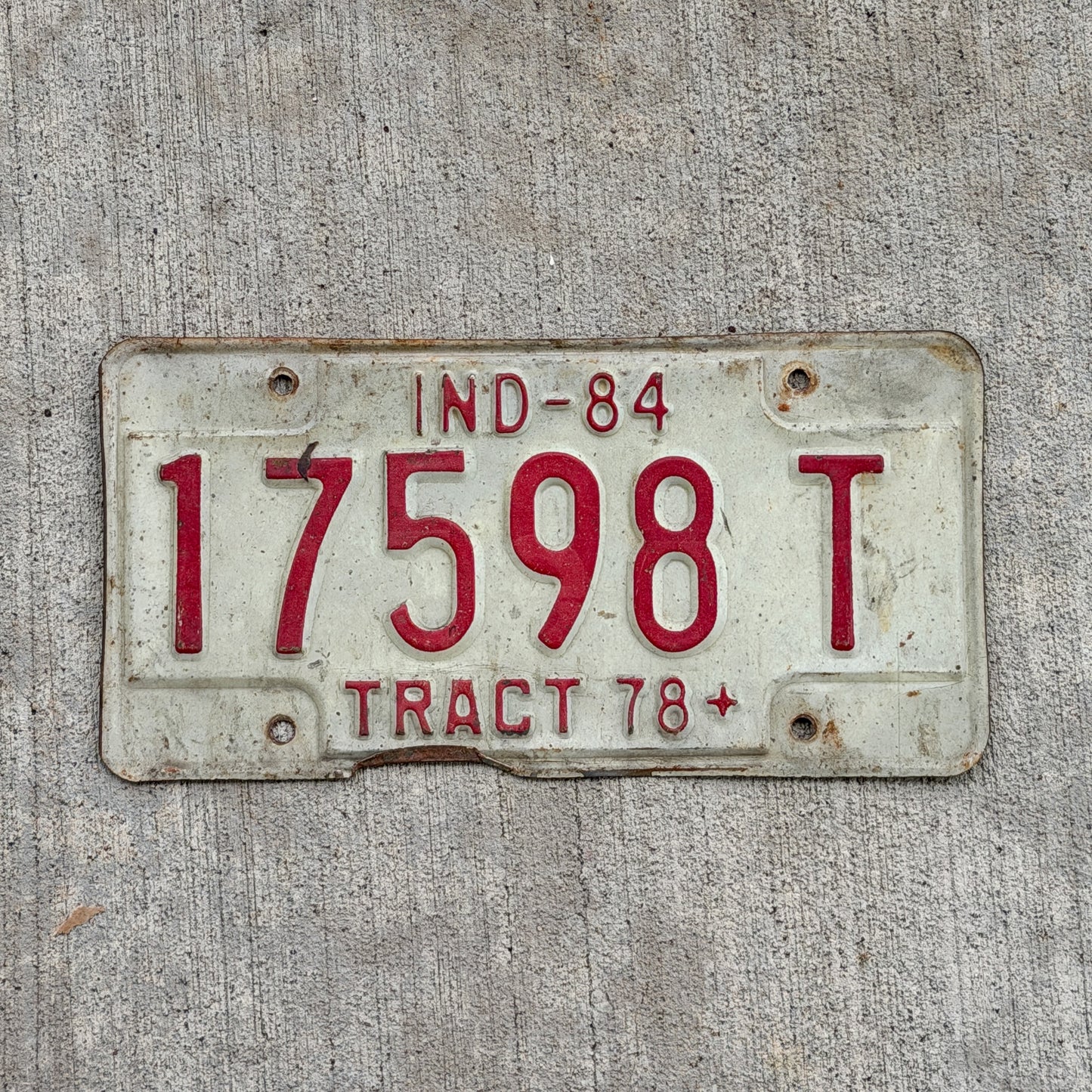 Photo of a 1984 Indiana Tractor License Plate Auto Tag Garage Decor Vintage 17598 T with original patina