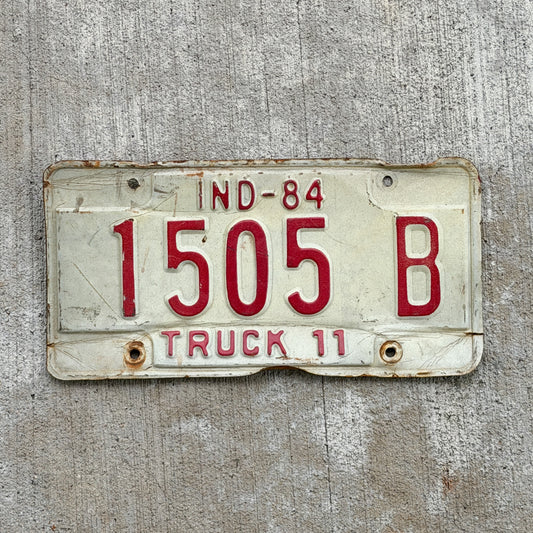 Photo of a 1984 Indiana Truck License Plate Auto Tag Garage Decor Vintage 1505 B with original patina