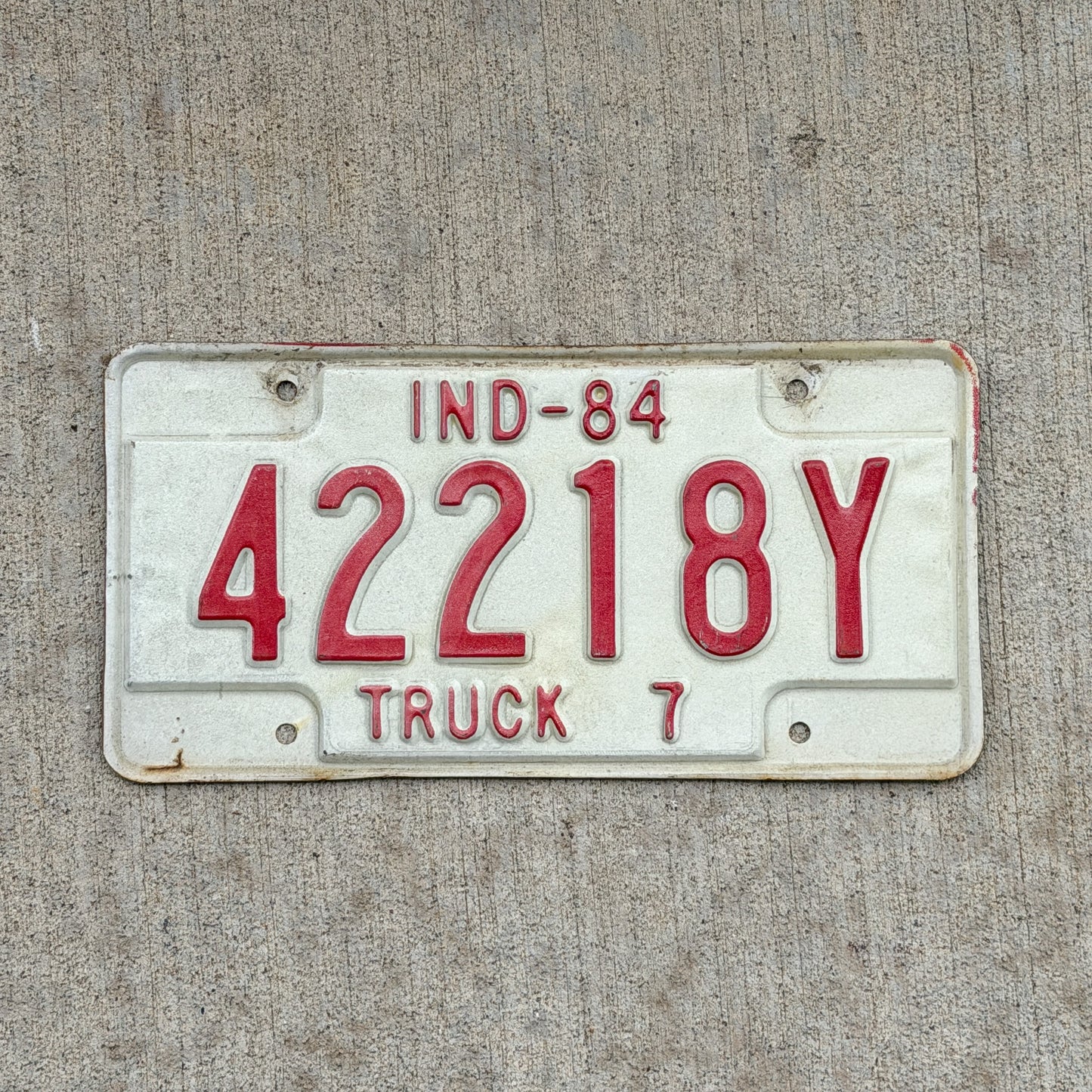 Photo of a 1984 Indiana Truck License Plate Auto Tag Garage Decor Vintage 42218 Y with original patina