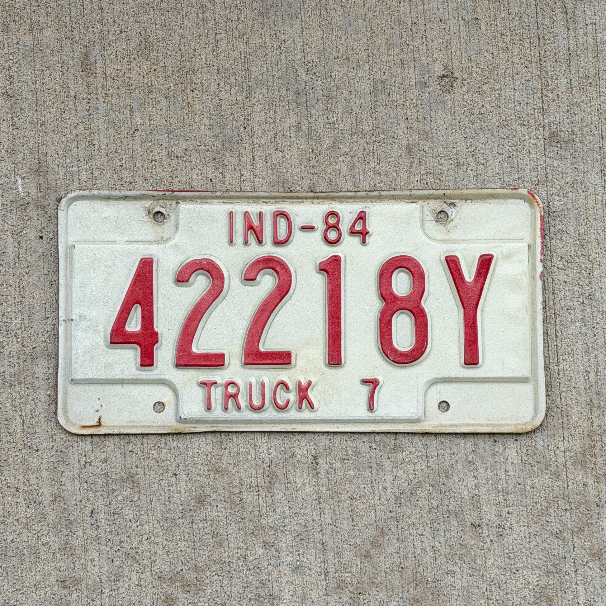 Photo of a 1984 Indiana Truck License Plate Auto Tag Garage Decor Vintage 42218 Y with original patina